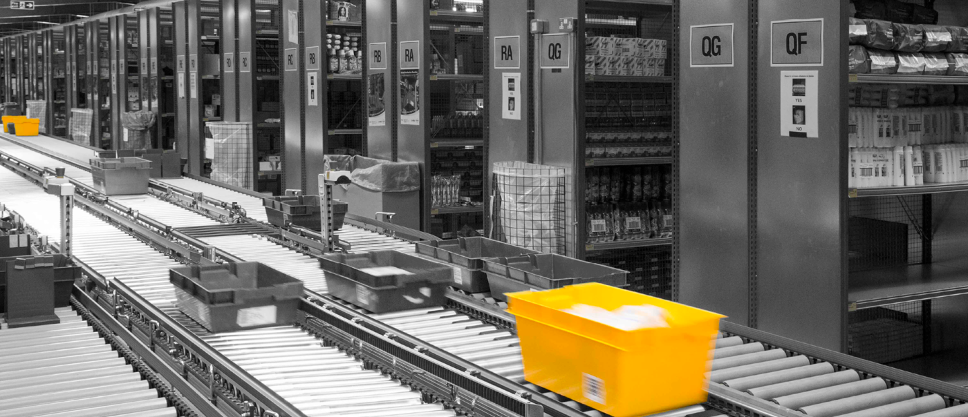 Golden tote in colour with black and white background of warehouse